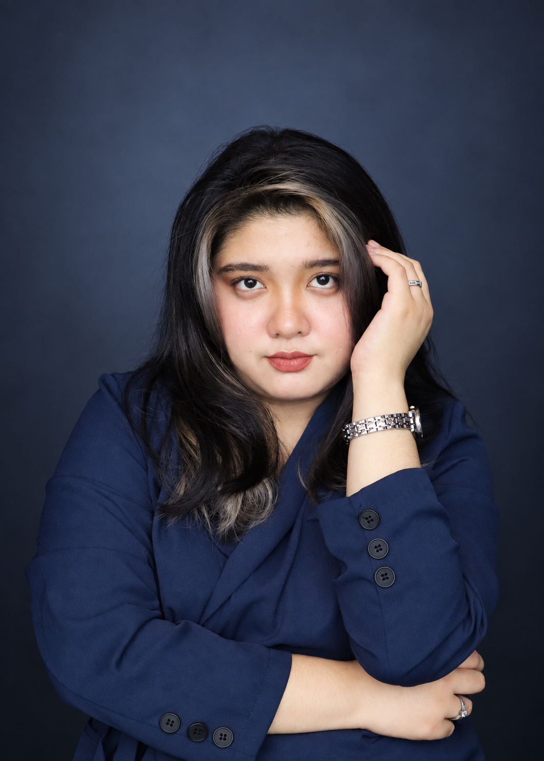 Angela Alvarez in a navy blue outfit