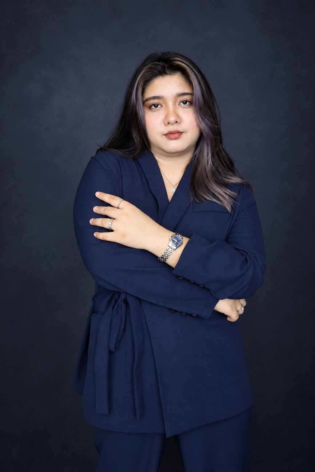 Angela Alvarez in a navy blue outfit